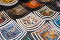 Colorful mosaic decorative plates on the market for sale on local street market in Ubud, island Bali, Indonesia . Souvenirs for