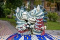 Colorful mosaic fountain in Kiev Ukraine with two hanging zebra sculptures