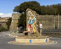 Colorful mosaic of a man on a roundabout near Montalcino, Italy.