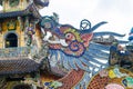 Colorful mosaic of porcelain in shape of dragon in pagoda in Vietnam