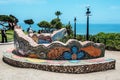 The colorful, mosaic-shaped benches with love sayings in the lovers` park in Lima,