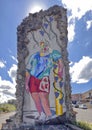 Colorful mosaic of a woman on a roundabout near Montalcino, Italy.