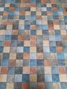 Colorful motif ceramic tile floor in grid. Matt stone tiles. Royalty Free Stock Photo