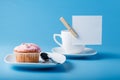 Colorful muffin with cup. Royalty Free Stock Photo