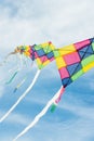 Colorful multi-color kites flying in blue sky Royalty Free Stock Photo