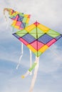 Colorful multi-color kites flying in blue sky Royalty Free Stock Photo