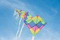Colorful multi-color kites flying in blue sky Royalty Free Stock Photo