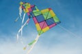 Colorful multi-color kites flying in blue sky Royalty Free Stock Photo