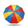 Colorful multi-segmented beach umbrella providing shade on sunny days Royalty Free Stock Photo