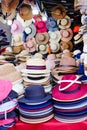 Colorful multicolored stacks of summer hats for sale at the night street market Royalty Free Stock Photo