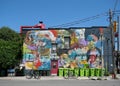 Colorful mural painted onto the wall of the building