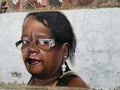 Colorful mural of street art about a stunning African American woman