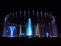 Colorful musical fountain. Magnificent night show of colorful lights, laser beams, music Royalty Free Stock Photo