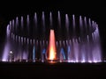 Colorful musical fountain. Magnificent night show of colorful lights, laser beams, music Royalty Free Stock Photo