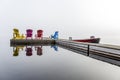 Colorful Muskoka Chairs on a Dock