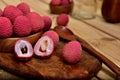 Colorful Natural organic Lychees in a wooden bowl