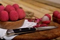 Colorful Natural organic Lychees in a wooden bowl