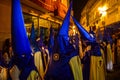 Colorful Nazarenes during an evening Easter procession