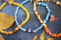 Colorful necklace and bracelet mix, beads and stone necklace, jewelry and blue background Royalty Free Stock Photo