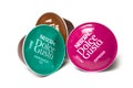 Colorful Nescafe expresso and tea capsules, the famous french brand of coffee dose on white background