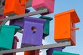 Colorful nesting boxes on blue sky