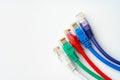 Colorful network cables switch on white background close up