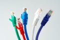 Colorful network cables switch on white background close up