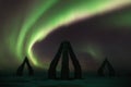 A colorful night with aurora borealis flying over the stonehenge iceland. Arctic henge in north Iceland. Raufarhofn