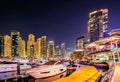 Colorful night dubai marina skyline. Luxury yacht dock. Dubai, United Arab Emirates. Royalty Free Stock Photo