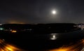 Colorful night landscape with lake, mountains, full moon, blue sky Khojasan Lake, Baku, Azerbaijan. Panoramic photo. Royalty Free Stock Photo