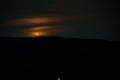 Colorful night landscape with lake, mountains, full moon, blue sky Khojasan Lake, Baku, Azerbaijan. Panoramic photo. Royalty Free Stock Photo