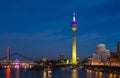 Colorful night scene of Rhein river at night in Dusseldorf. Rheinturm tower in soft night light, Nordrhein-Westfalen, Germany