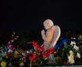 Colorful Night time scene Angel praying atop a tomb Royalty Free Stock Photo