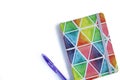 Colorful notebook with pen on white background. Rainbow colors Royalty Free Stock Photo