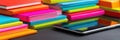 Colorful Notebooks and Digital Tablet Arranged on a Desk Create a Vibrant Workspace for Creativity and Productivity Royalty Free Stock Photo
