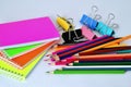 Colorful notepads clip for paper and pencils on a white background in the correct geometry Royalty Free Stock Photo
