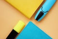 Colorful notepads and pens on desk. Top view Royalty Free Stock Photo