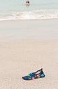 Colorful, nylon, beach, sneaker, on a sandy, tropical beach