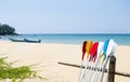 Colorful oars with beach background, water sport equipment