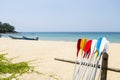 Colorful oars with beach background, water sport, holiday activity at the beac