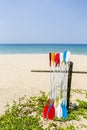 Colorful oars over fine sandy beach with clear blue sky background, tropical island beach in south of Thailand