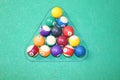 Colorful object balls arranged in preparation for the start of an 8-ball game of pool billiards Royalty Free Stock Photo