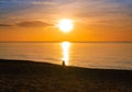 Colorful ocean beach sunrise with deep blue sky and sun reflection. orange and golden sunset sky calmness tranquil relaxing