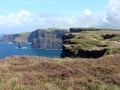 Colorful ocean views, green grassy rocks, rocks and blue water