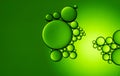 colorful oil drops on a green background water surface Royalty Free Stock Photo