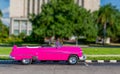 Colorful, old, antique, made over vehicle resembling 1950 American car in Havana, Cuba