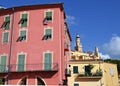 Colorful old buildings and church tower in Menton