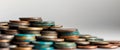Colorful old coins stacked close up creating intriguing background Royalty Free Stock Photo