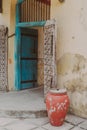Colorful old doorway, pot and walls from the former prison on Prison Island (Changuu Island) Zanzibar Tanzania Africa
