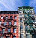 Colorful old historic apartment buildings with fire escapes in Manhattan New York City Royalty Free Stock Photo